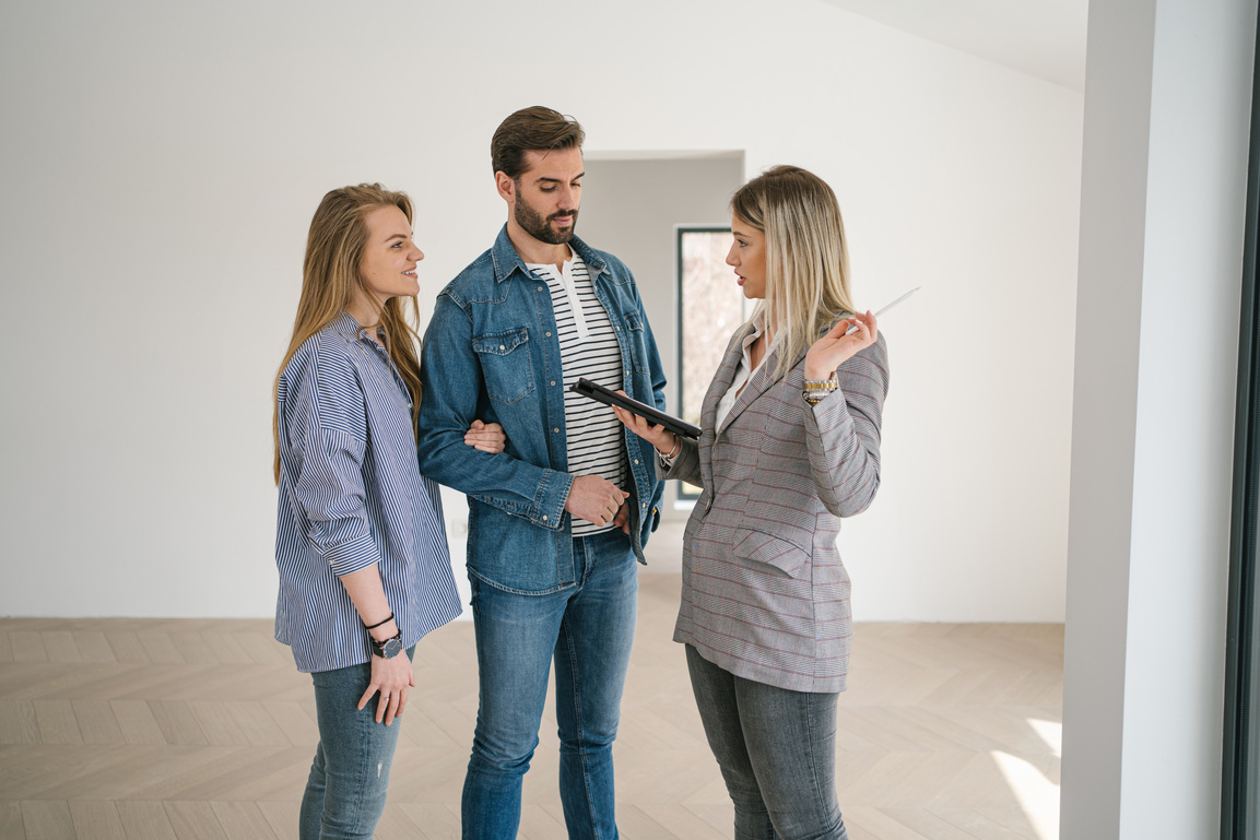 Blond real estate expert selling a house